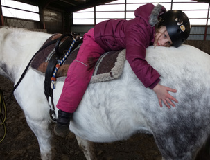 Mädchen auf Pferd